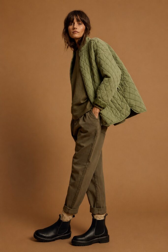 Quilted barn jacket with a fitted jumper and tailored trousers