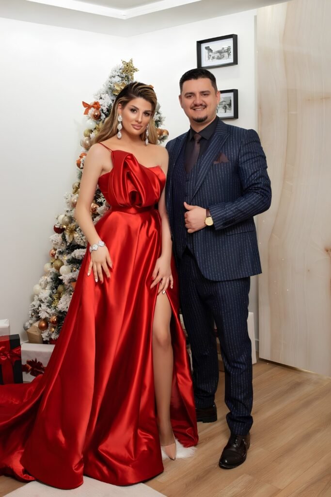 Couple in a red satin gown and navy suit