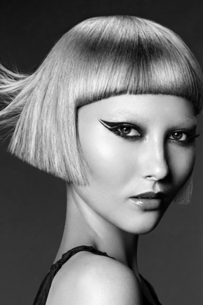 Sleek centre-parted helmet hair
