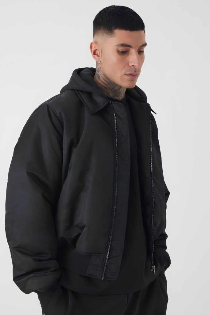 Bomber jacket over a hooded layer