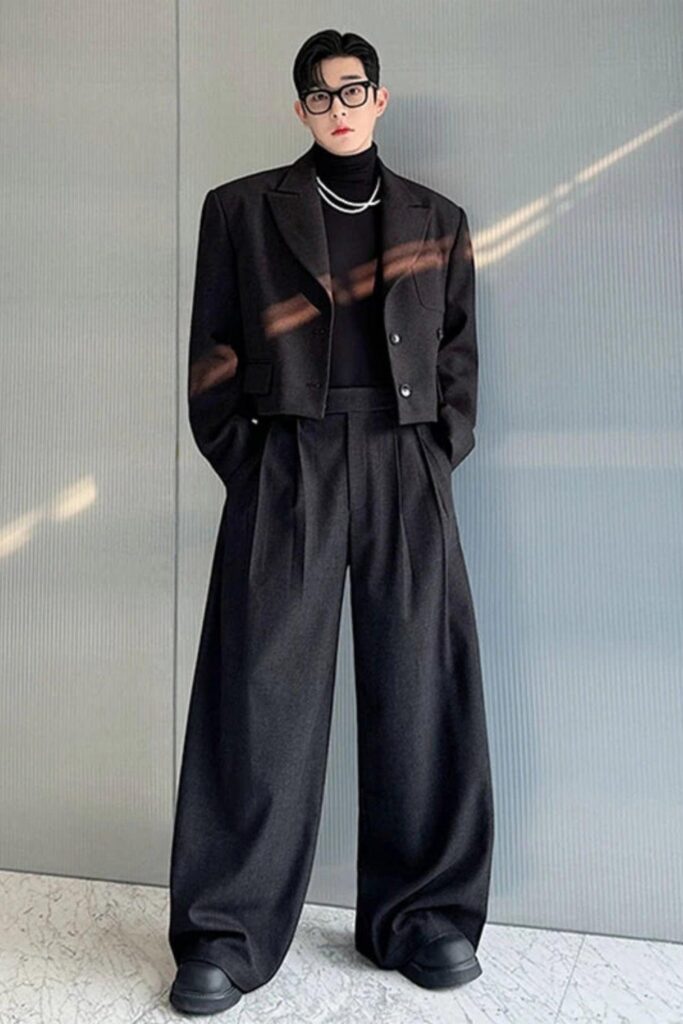 Wide black trousers with a cropped top layer