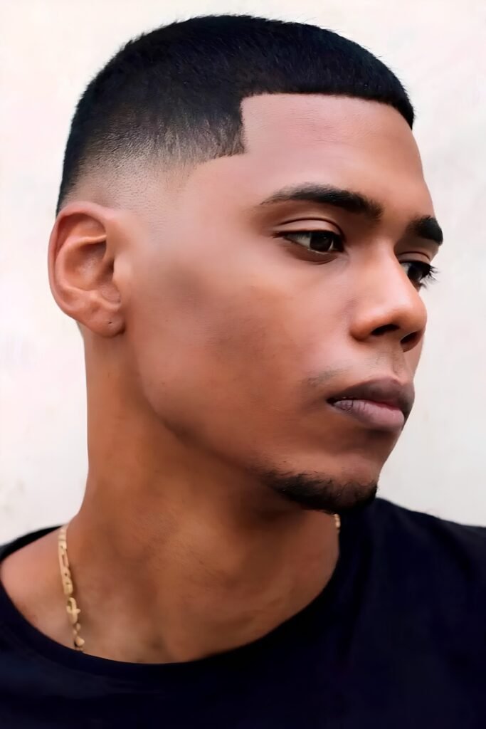 Side view of a buzz cut with a sharp line-up