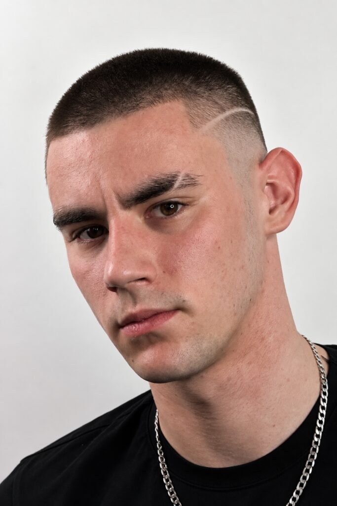 Buzz fade with a single shaved line design
