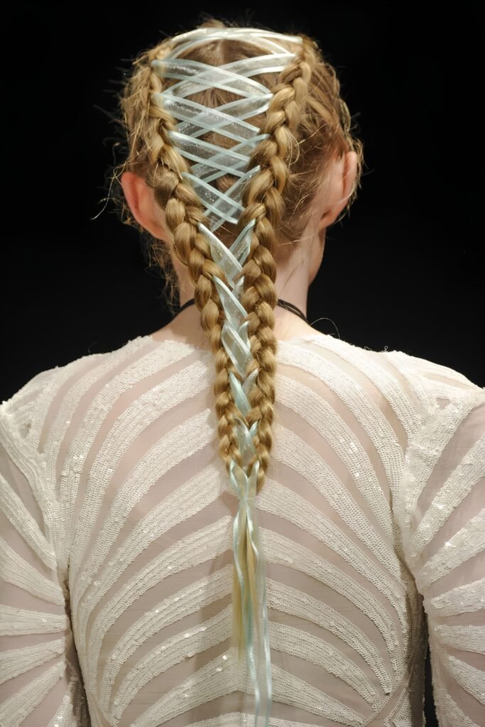 Back view of corset-laced braids with ribbon