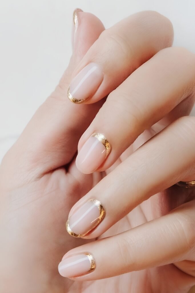 Nude nails with dainty gold details