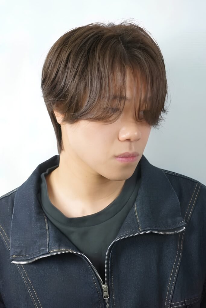 Man with a fine-hair airy flow and straight bangs