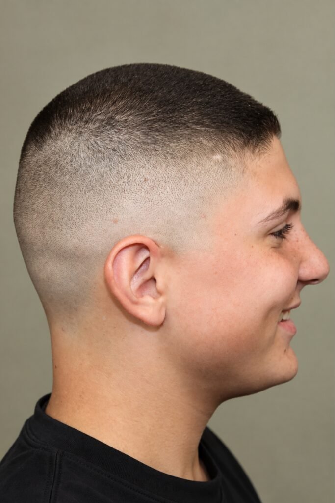Side profile of a buzz cut with a high fade