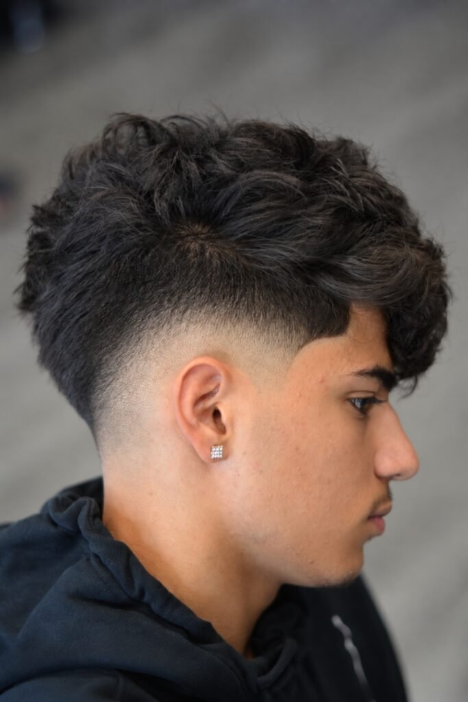 Side view of a messy top with a drop fade