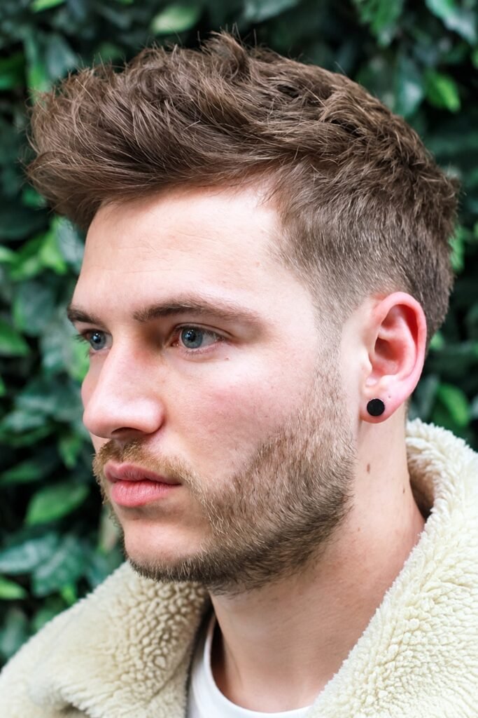 Man with a messy quiff and stubble