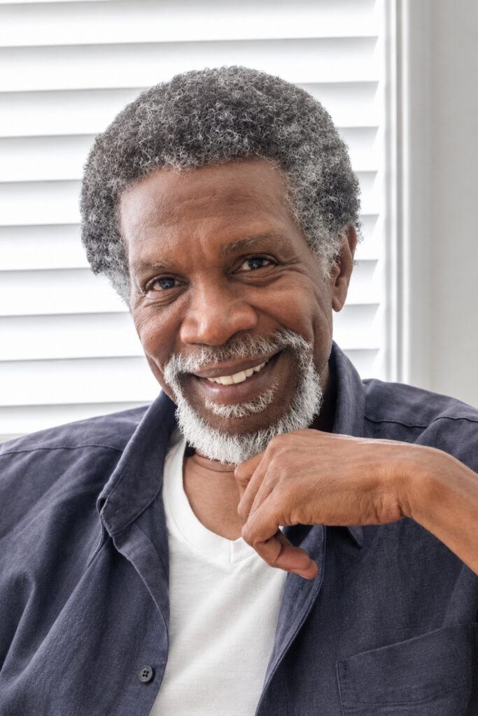 Short afro with a gray beard