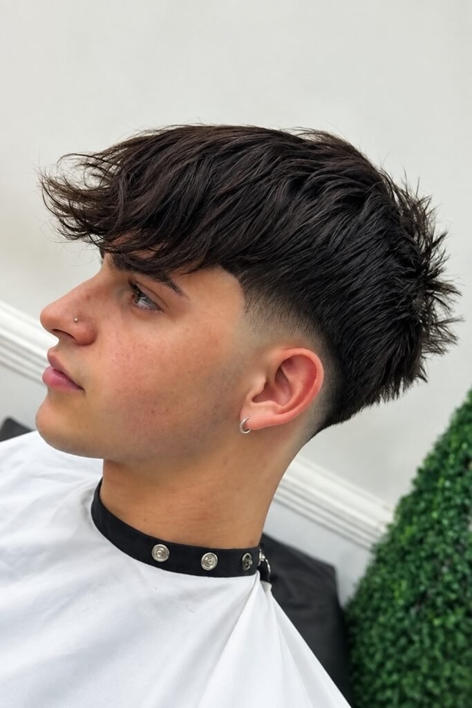 Side view of a short shag with a low fade
