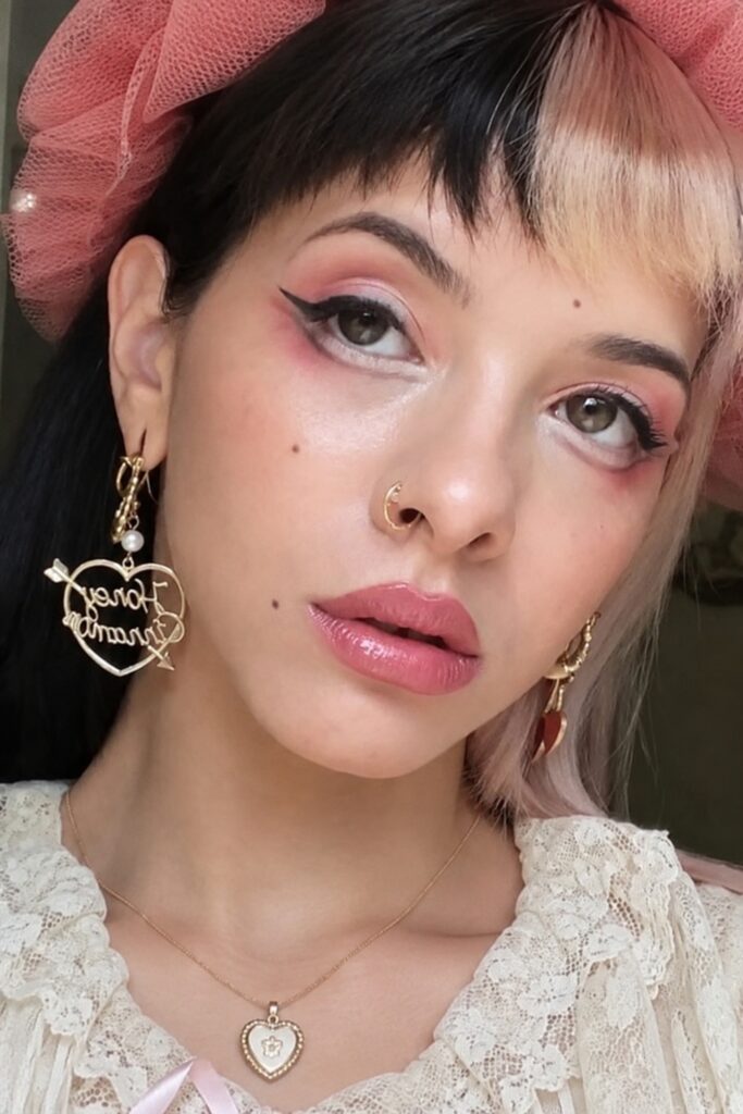 Strawberry pink blush across the cheeks