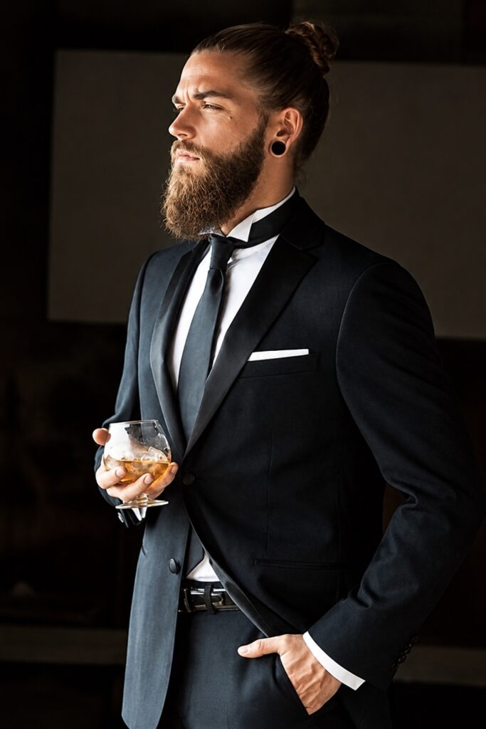 Textured man bun with a full beard