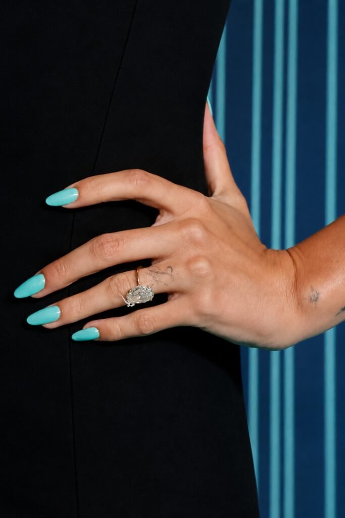Tiffany-blue almond nails with an engagement ring
