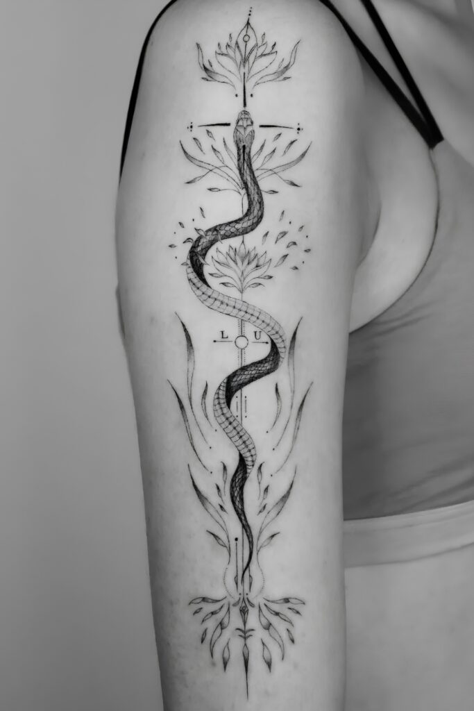 Botanical snake tattoo