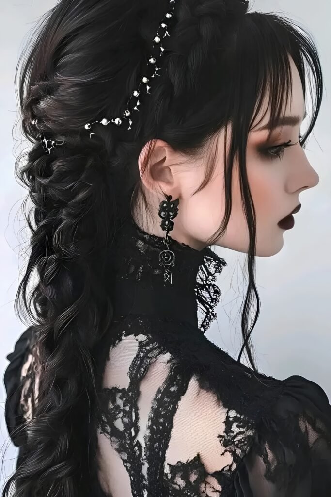 Side view of a long dark braid with pearl pins and a fringe
