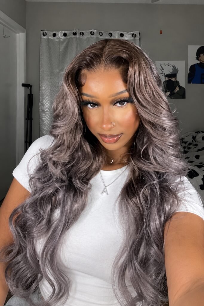 Long ash-beige waves with a lilac cast on a dark root