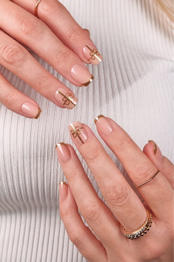 Short square nude nails with fine gold line details