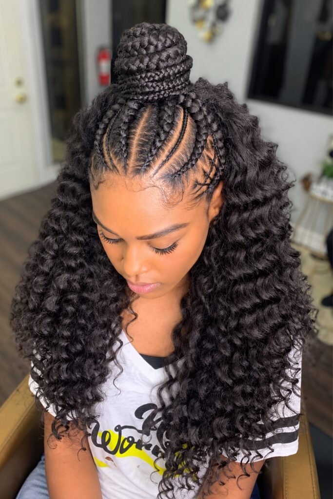Half-up goddess braids with a top knot and loose curls