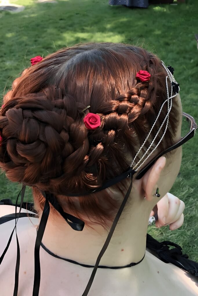Fairy hairstyle: Intricate Updo with Braided Sections and Roses