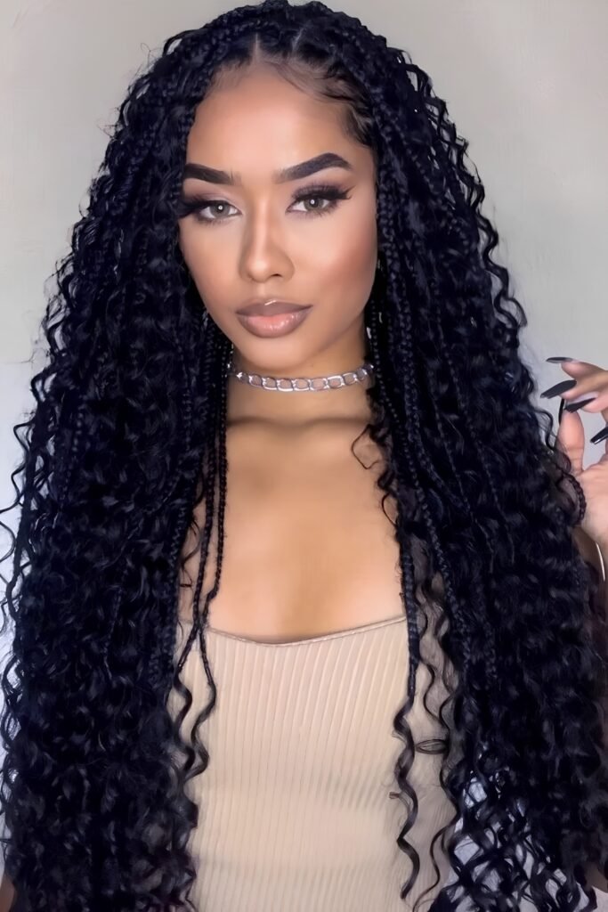Long jet-black goddess braids with defined curls