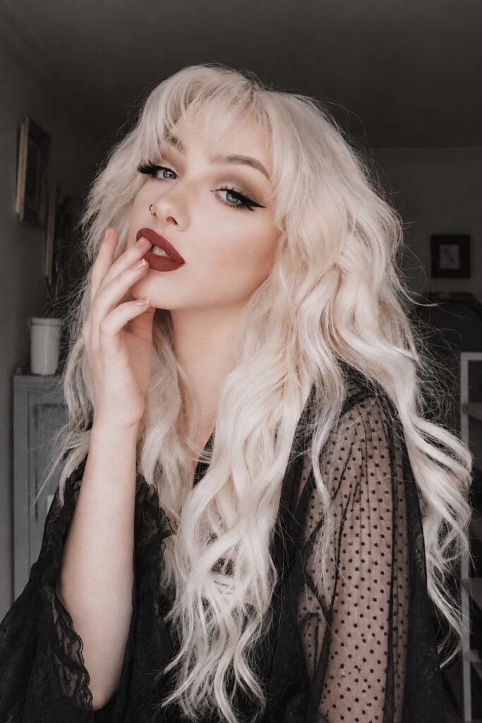 Extra-long platinum blonde hair in loose soft waves