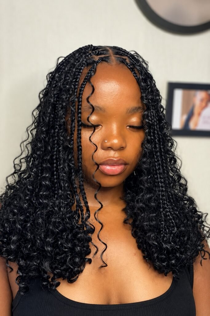 Medium goddess braids with loose curls, worn down to the shoulders
