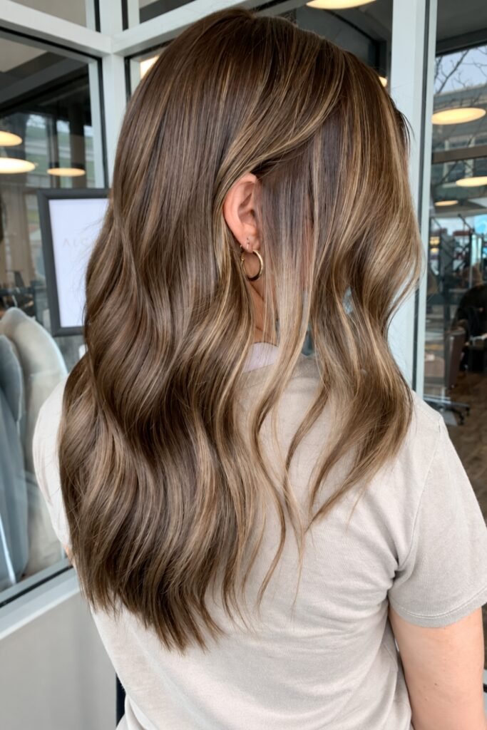 Brown wavy hair with multidimensional beige balayage