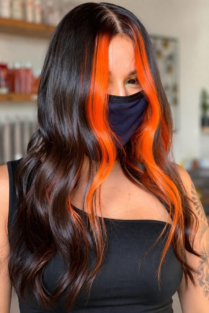 Long dark wavy hair with two neon orange front panels