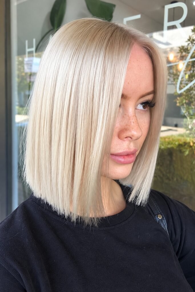 Woman with a platinum blunt lob
