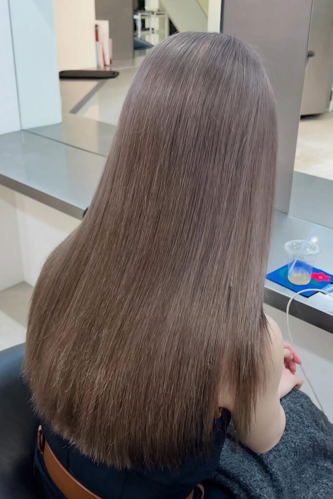 Back view of straight ash-beige brown hair