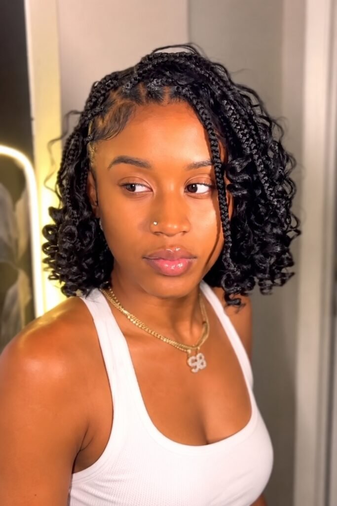 Short curly goddess braids at bob length