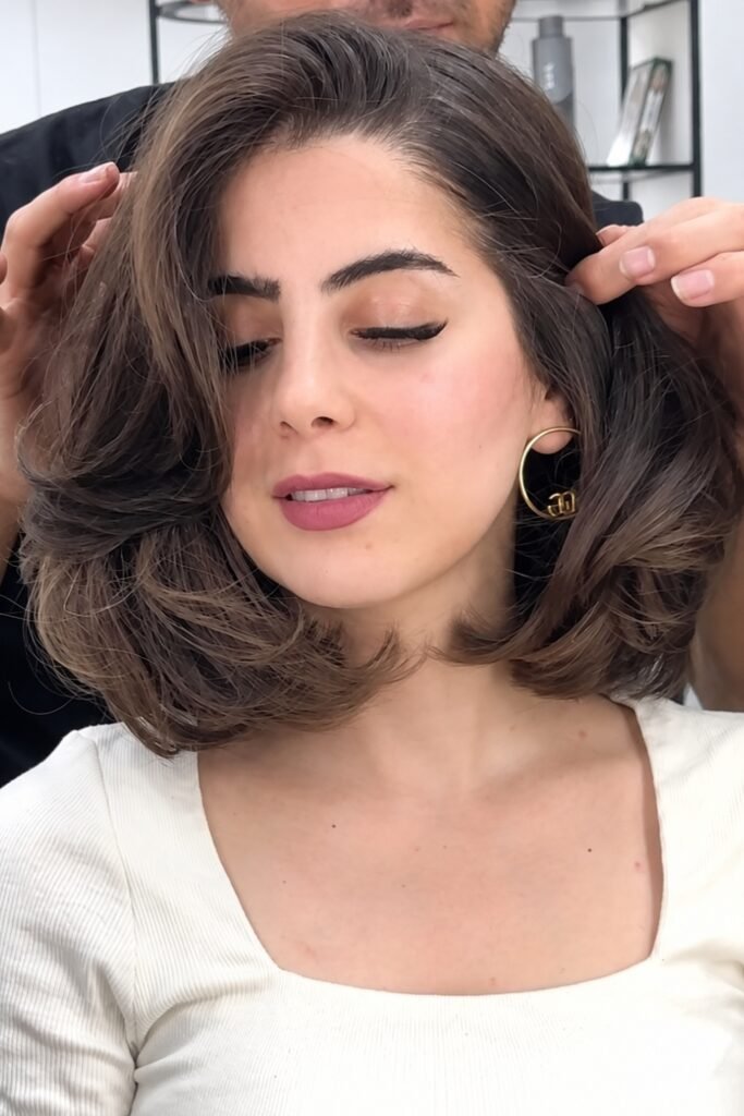 Side-parted layered cut with curled-under ends
