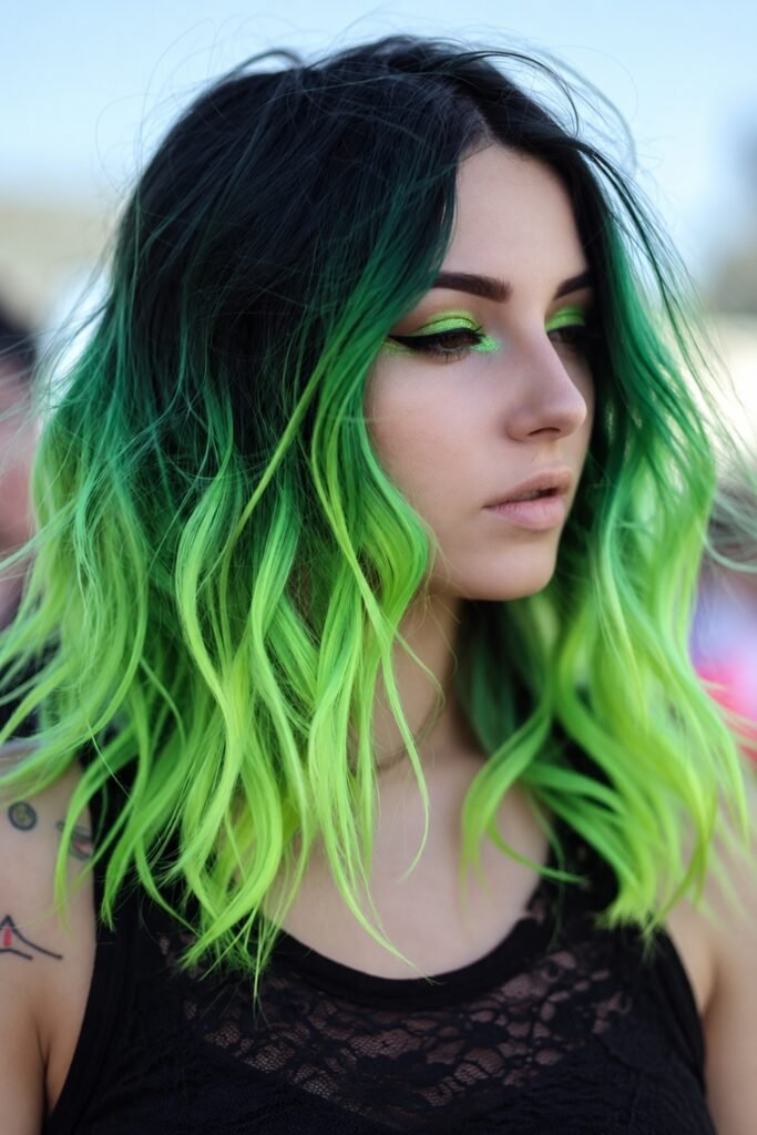 Wavy hair with black roots melting into neon lime lengths