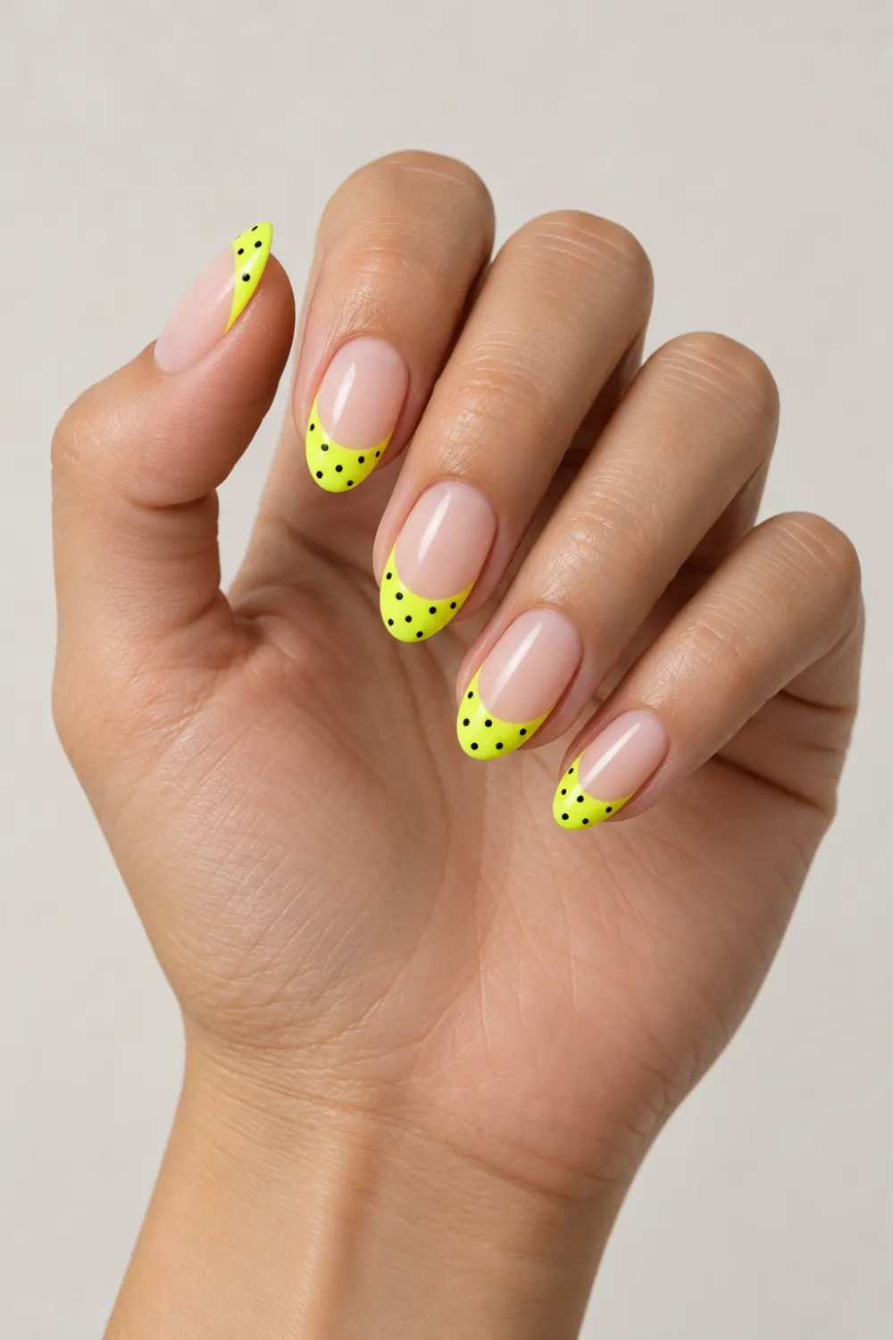 Neon yellow French tips with tiny black polka dots