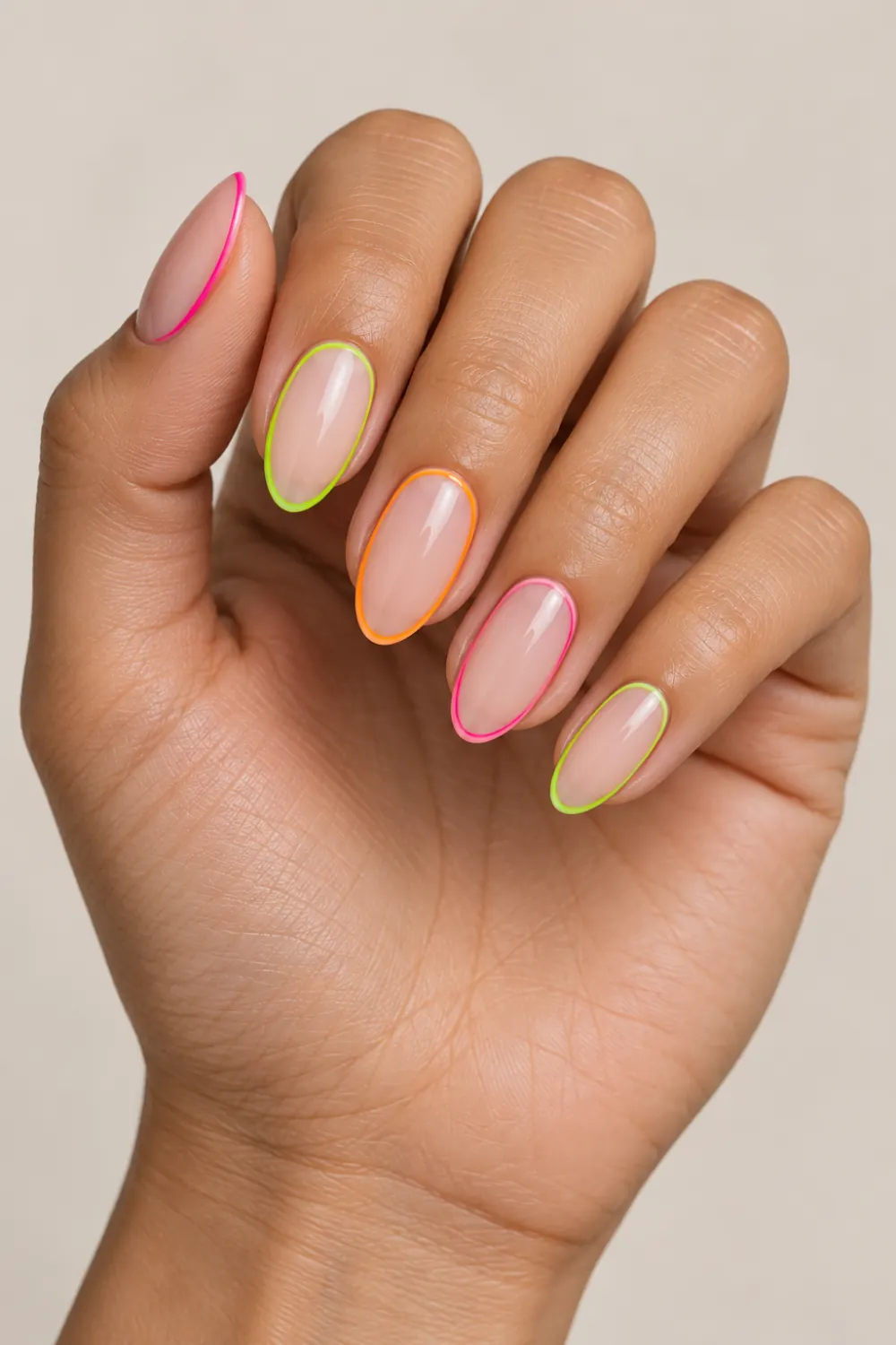 Nude nails outlined with thin neon frame lines