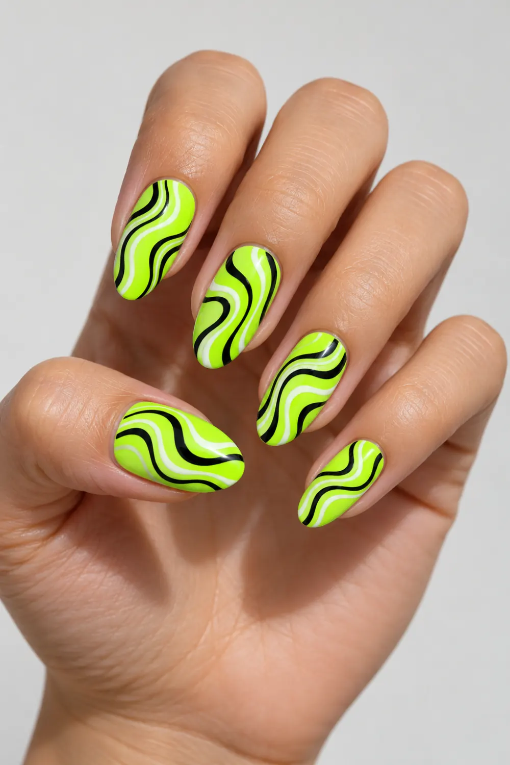 Neon lime nails with black and white ripple stripes