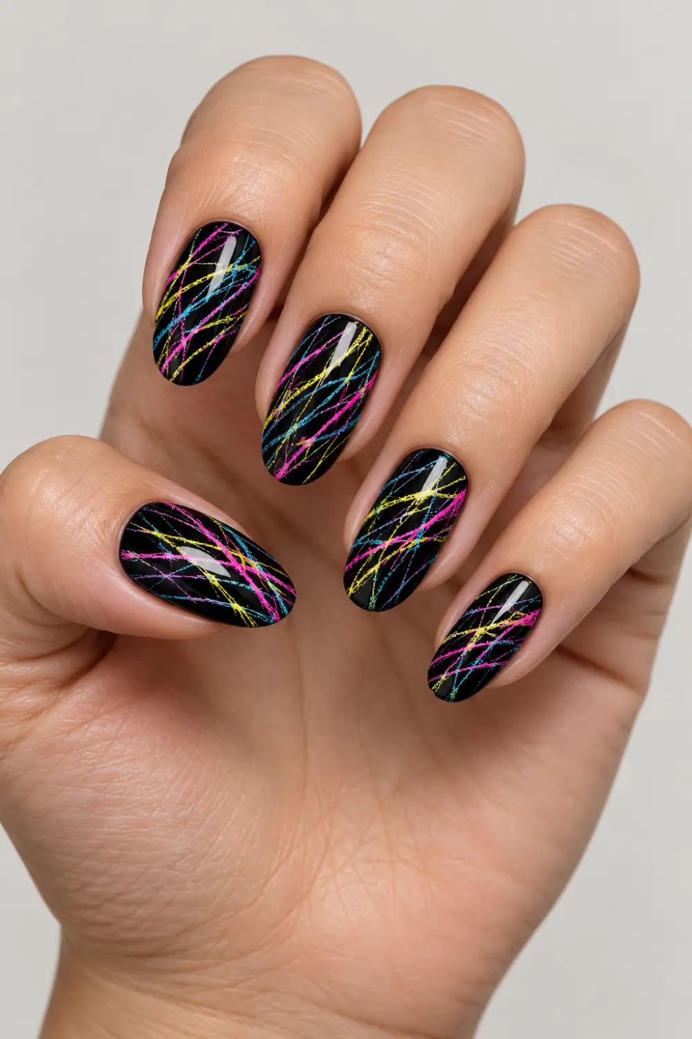 Black nails with fine neon sugar-spun stripes